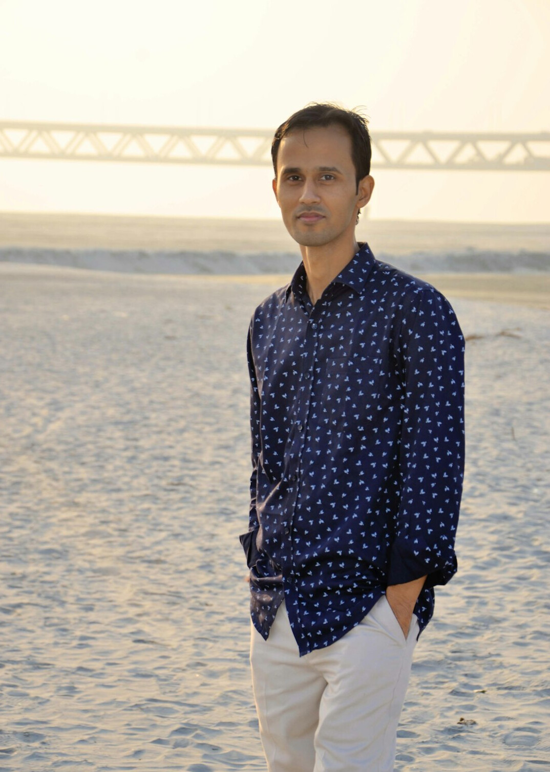Portrait of a man with short hair in a casual shirt
