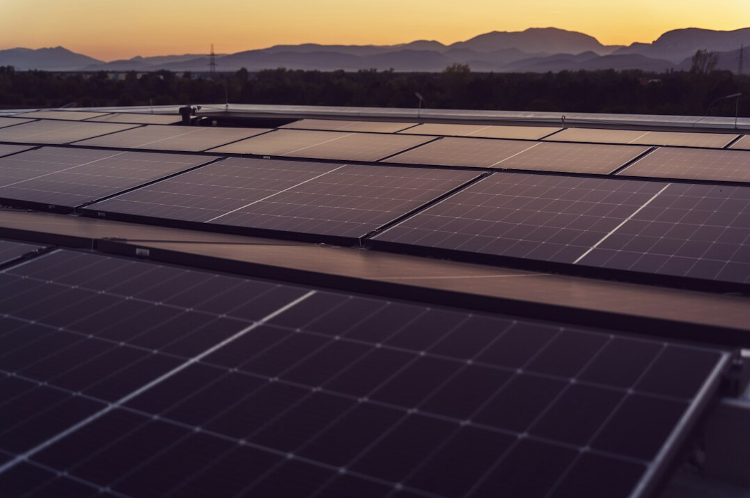 Solar panels reflecting the sky on a roof